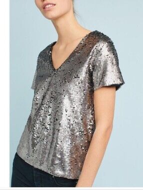 Anthropologie Vanessa Virginia silver sequin top featuring a v-neck and short sl
